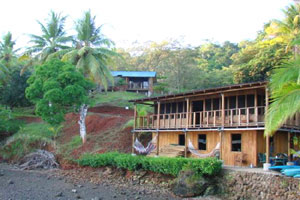 The two-story restaurant and owner's quarters sit near the dock.